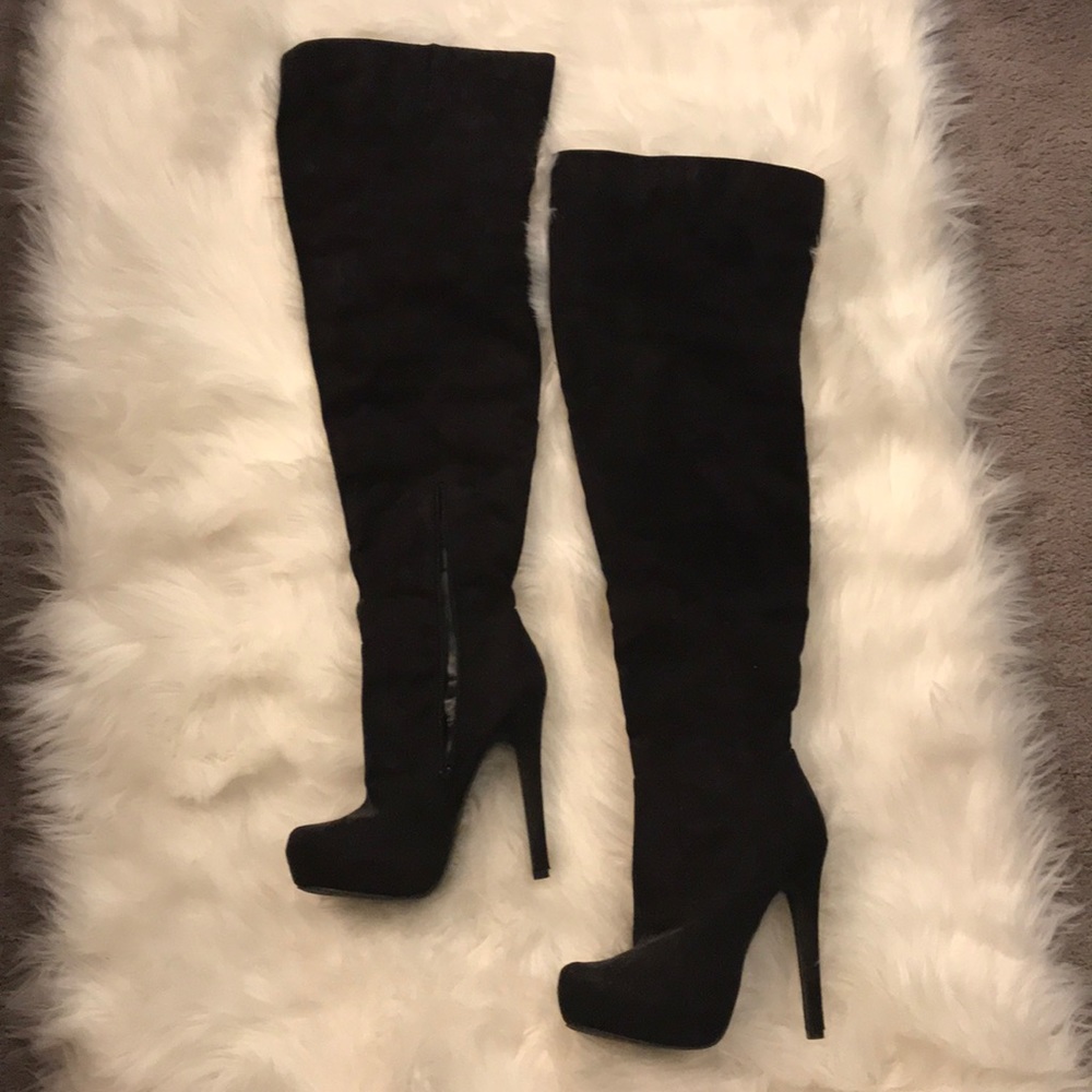Black thigh high heeled boots